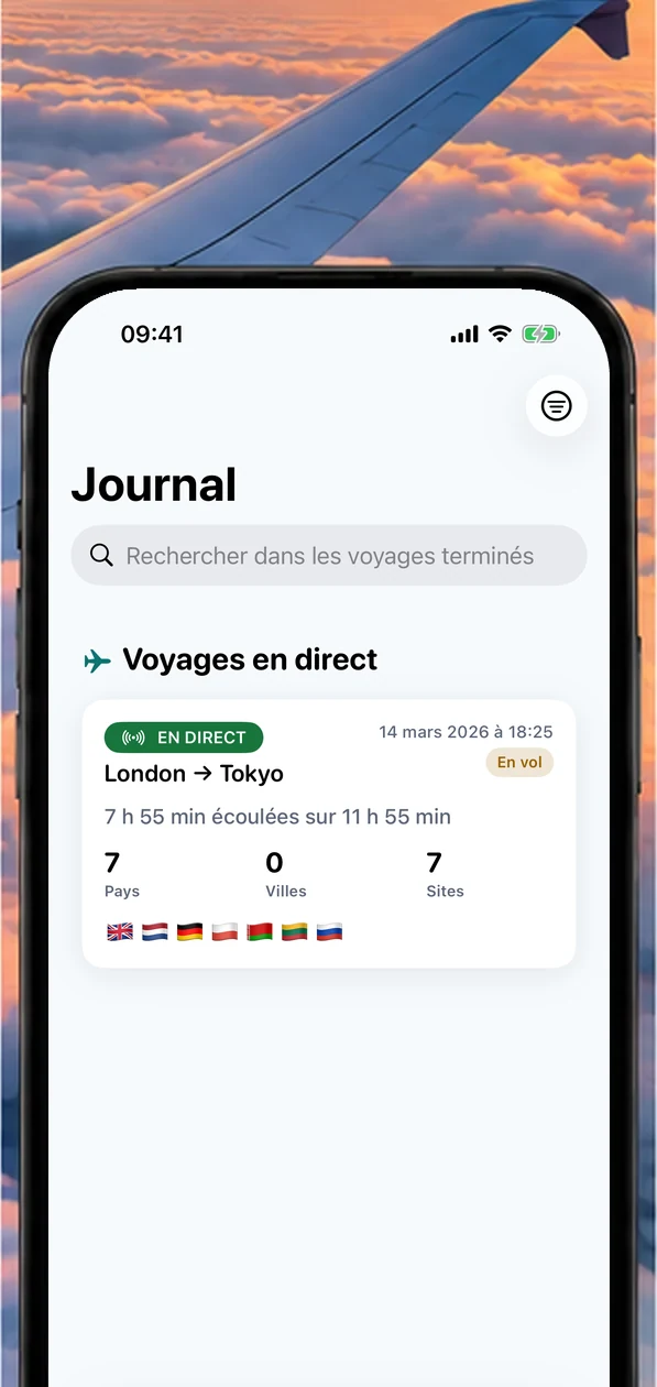 Écran Journal d'AirReveal au-dessus des nuages au coucher du soleil, avec une aile d'avion